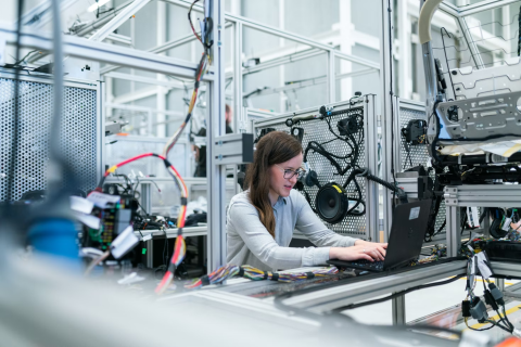 Image of woman working in manufacturing plant