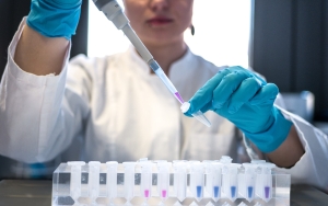 Image of doctor filling test tubes